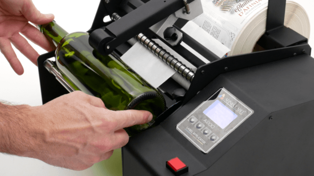 Wine bottle semi-automatic label applicator